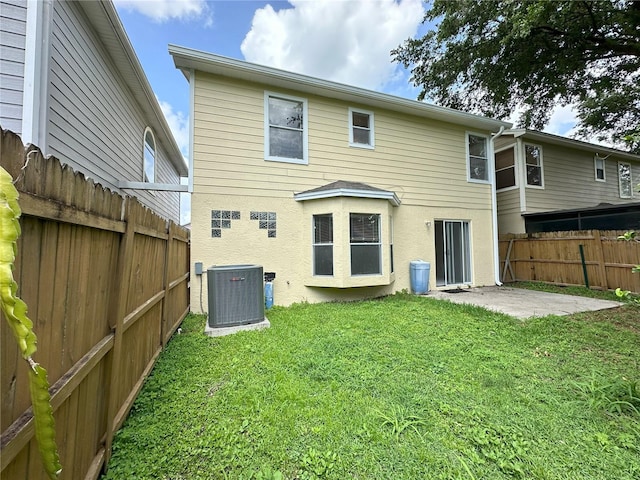 3352 Hamlet Loop, Winter Park, FL 32792 - back of house with a fenced backyard, a patio, and stucco siding