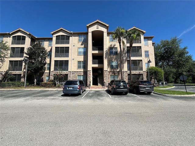 1370 Tuscan Ter Unit 2202, Davenport, FL 33896 - view of building exterior featuring uncovered parking
