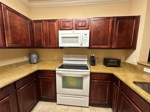 1370 Tuscan Ter Unit 2202, Davenport, FL 33896 - kitchen with white appliances, crown molding, light tile patterned flooring, light countertops, and dark brown cabinets
