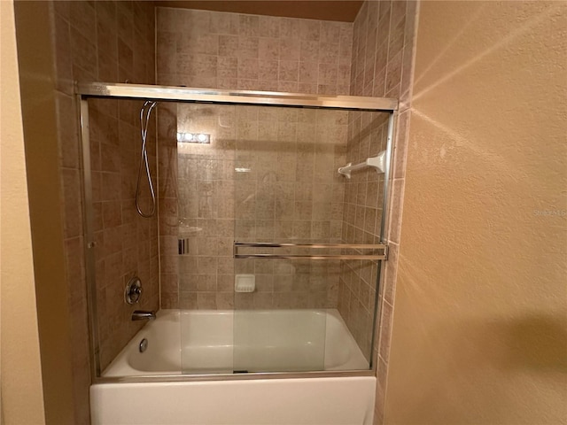 1370 Tuscan Ter Unit 2202, Davenport, FL 33896 - full bathroom with bath / shower combo with glass door and a textured wall