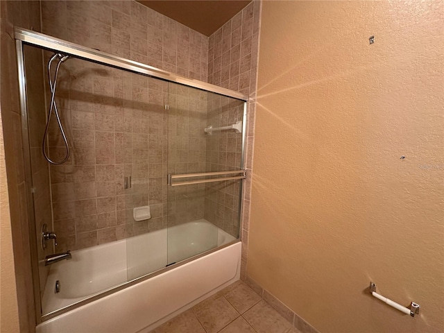 1370 Tuscan Ter Unit 2202, Davenport, FL 33896 - bathroom with tile patterned flooring, enclosed tub / shower combo, and a textured wall