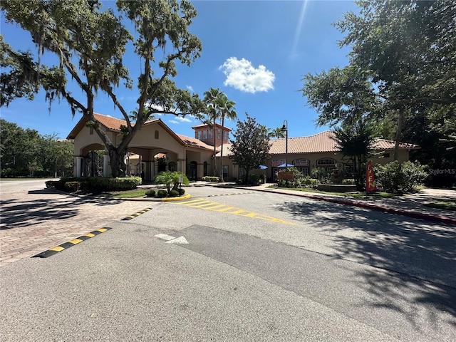 1370 Tuscan Ter Unit 2202, Davenport, FL 33896 - view of asphalt road with curbs and sidewalks