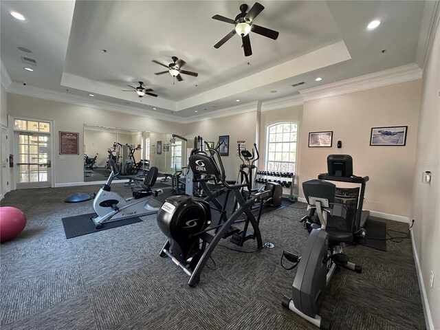 1370 Tuscan Ter Unit 2202, Davenport, FL 33896 - workout area featuring a tray ceiling, ceiling fan, carpet, and crown molding