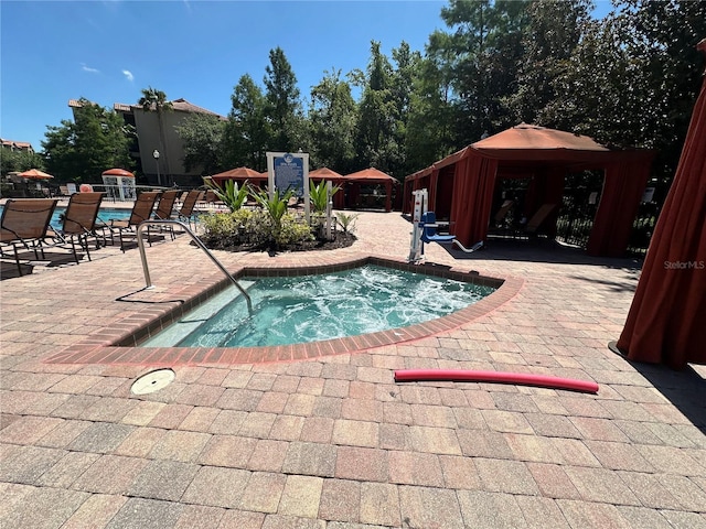 1370 Tuscan Ter Unit 2202, Davenport, FL 33896 - view of swimming pool featuring a gazebo, a hot tub, a patio area, and a pool