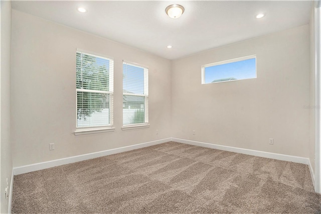 9955 Patrician Dr, New Port Richey, FL 34655 - unfurnished room with carpet floors and recessed lighting