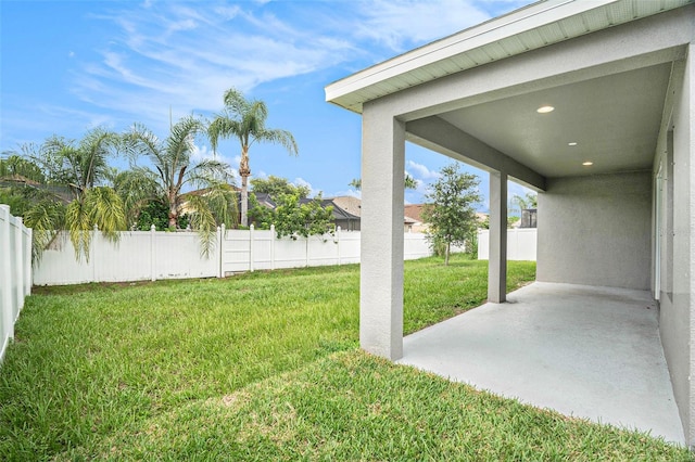 9955 Patrician Dr, New Port Richey, FL 34655 - fenced backyard featuring a patio