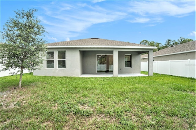 9955 Patrician Dr, New Port Richey, FL 34655 - rear view of property with stucco siding and a patio area