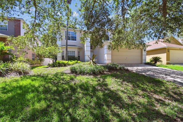 1936 Westpointe Cir, Orlando, FL 32835 - obstructed view of property featuring driveway, a garage, and stucco siding