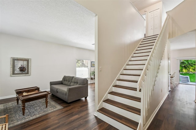 1936 Westpointe Cir, Orlando, FL 32835 - staircase with wood finished floors and a textured ceiling