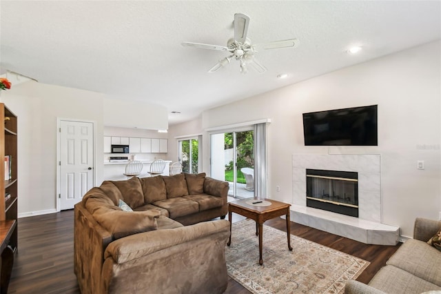 1936 Westpointe Cir, Orlando, FL 32835 - living room with a premium fireplace, ceiling fan, dark wood finished floors, and recessed lighting