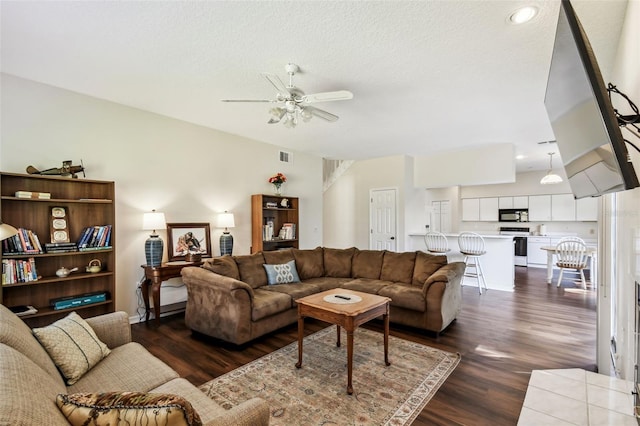 1936 Westpointe Cir, Orlando, FL 32835 - living area featuring dark wood-style flooring, a ceiling fan, and a textured ceiling