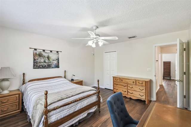 1936 Westpointe Cir, Orlando, FL 32835 - bedroom featuring a closet, wood finished floors, a textured ceiling, and ceiling fan