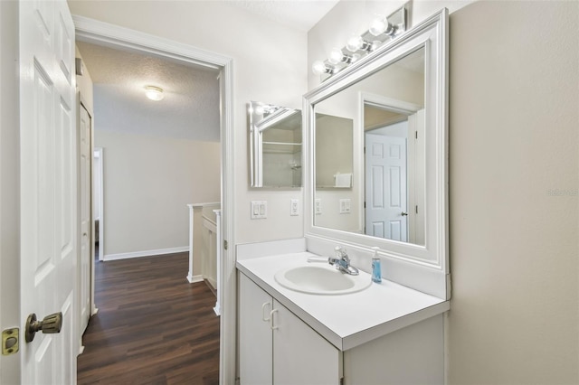 1936 Westpointe Cir, Orlando, FL 32835 - bathroom with vanity, wood finished floors, and a textured ceiling