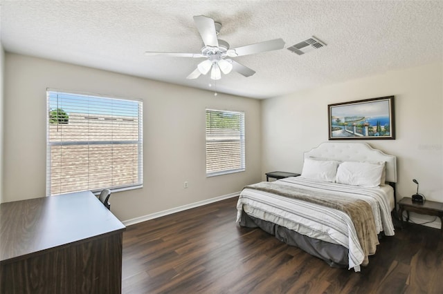 1936 Westpointe Cir, Orlando, FL 32835 - bedroom featuring dark wood-type flooring, a textured ceiling, and a ceiling fan