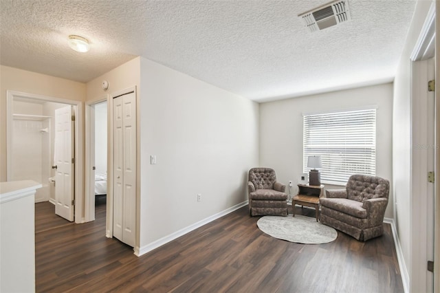 1936 Westpointe Cir, Orlando, FL 32835 - living area featuring dark wood-type flooring and a textured ceiling