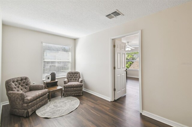 1936 Westpointe Cir, Orlando, FL 32835 - living area featuring dark wood-type flooring and a textured ceiling