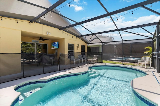 165 Scrub Jay Way, Davenport, FL 33896 - outdoor pool with a patio, ceiling fan, and a lanai