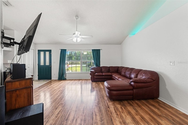 15364 Mount Sparrow Rd, Weeki Wachee, FL 34614 - living area with wood finished floors, a ceiling fan, and lofted ceiling