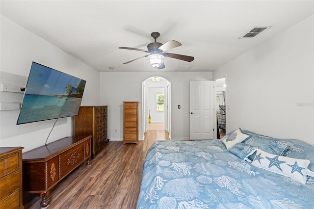 15364 Mount Sparrow Rd, Weeki Wachee, FL 34614 - bedroom featuring wood finished floors, arched walkways, and a ceiling fan