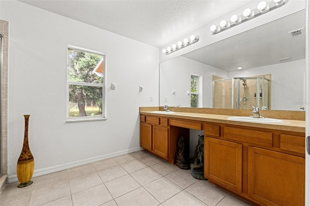 15364 Mount Sparrow Rd, Weeki Wachee, FL 34614 - full bathroom with double vanity, a stall shower, tile patterned floors, and plenty of natural light