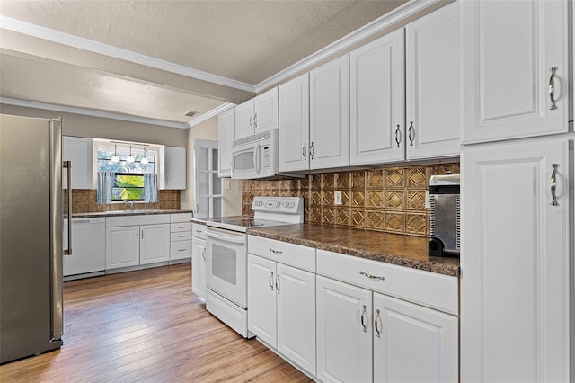 4130 W Main St, Mims, FL 32754 - kitchen featuring white appliances, dark countertops, backsplash, white cabinetry, and a textured ceiling