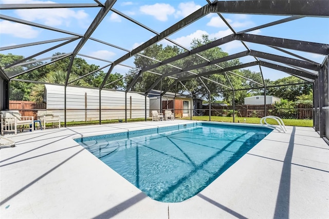 4130 W Main St, Mims, FL 32754 - view of pool with a fenced backyard, a patio, a lanai, and a shed