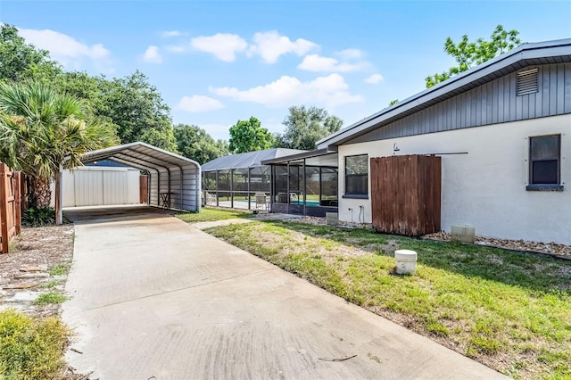 4130 W Main St, Mims, FL 32754 - view of yard featuring a carport and concrete driveway
