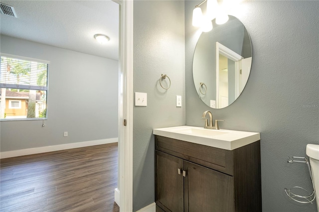 11081 Savannah Landing Cir, Orlando, FL 32832 - bathroom featuring vanity and wood finished floors