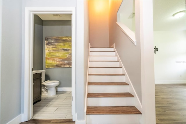 11081 Savannah Landing Cir, Orlando, FL 32832 - stairs with baseboards and wood finished floors