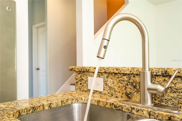 11081 Savannah Landing Cir, Orlando, FL 32832 - kitchen view of a sink and light stone counters