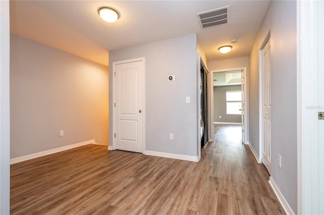 11081 Savannah Landing Cir, Orlando, FL 32832 - hallway with wood finished floors and baseboards