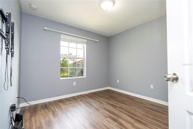 11081 Savannah Landing Cir, Orlando, FL 32832 - unfurnished room with wood finished floors and a smoke detector