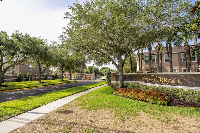 11081 Savannah Landing Cir, Orlando, FL 32832 - community / neighborhood sign with a lawn and a residential view