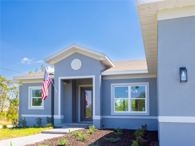 14073 Naylor Ave, Port Charlotte, FL 33981 - view of front of property with stucco siding and a shingled roof