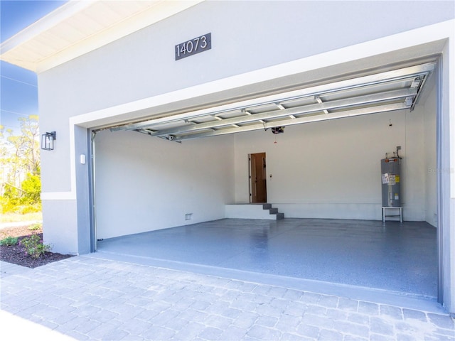 14073 Naylor Ave, Port Charlotte, FL 33981 - garage with water heater and a garage door opener