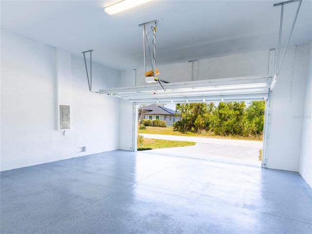 14073 Naylor Ave, Port Charlotte, FL 33981 - garage with a garage door opener and electric panel