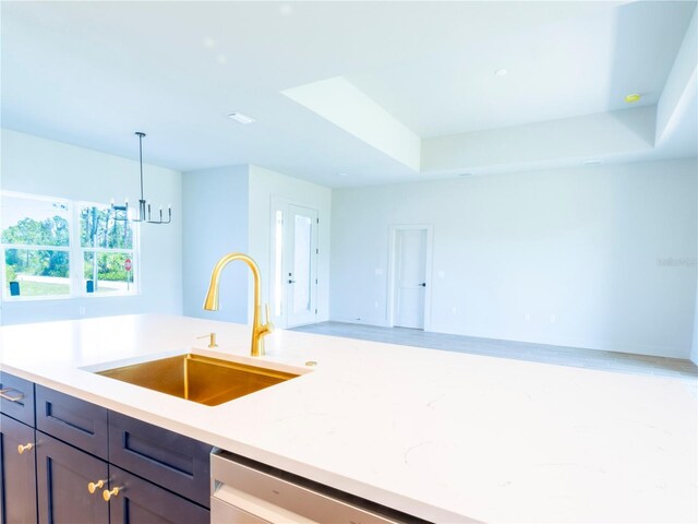 14073 Naylor Ave, Port Charlotte, FL 33981 - kitchen with light countertops, pendant lighting, open floor plan, and a chandelier