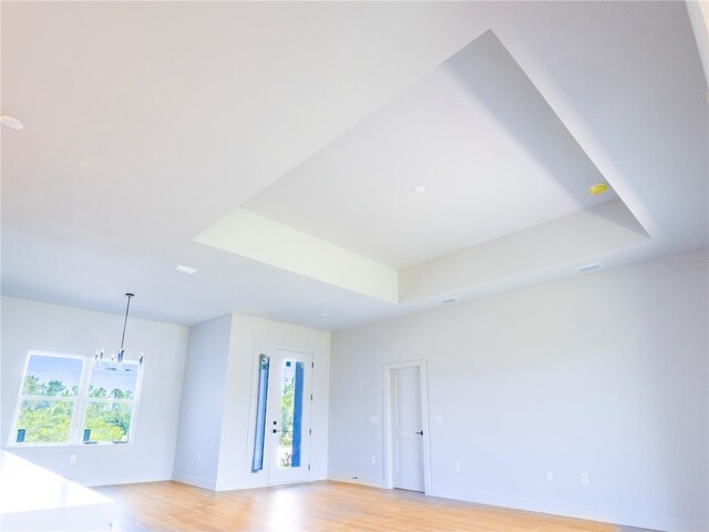 14073 Naylor Ave, Port Charlotte, FL 33981 - unfurnished room featuring light wood-style flooring and a raised ceiling