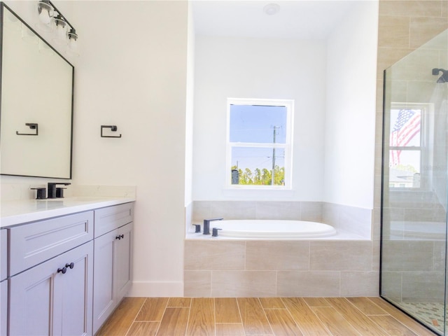14073 Naylor Ave, Port Charlotte, FL 33981 - full bath with vanity, plenty of natural light, a garden tub, and a tile shower