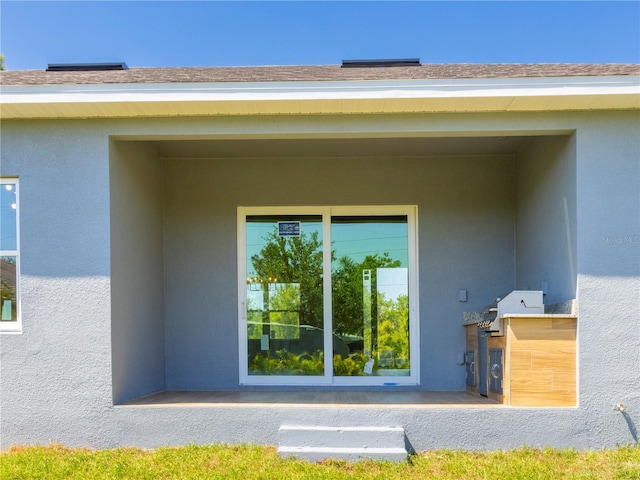 14073 Naylor Ave, Port Charlotte, FL 33981 - doorway to property featuring stucco siding