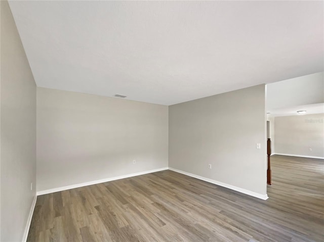 4209 SW 33rd St, Ocala, FL 34474 - spare room featuring wood finished floors and baseboards