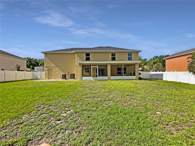 4209 SW 33rd St, Ocala, FL 34474 - rear view of house featuring a sunroom, stucco siding, and a fenced backyard