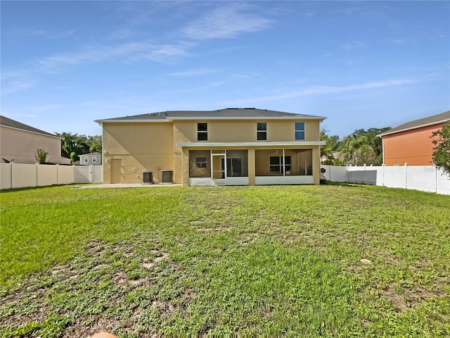 4209 SW 33rd St, Ocala, FL 34474 - back of house with stucco siding, a sunroom, and a fenced backyard