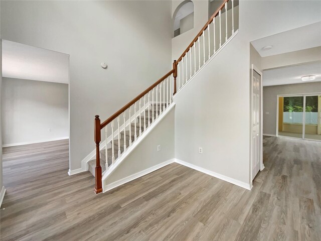 4209 SW 33rd St, Ocala, FL 34474 - staircase featuring wood finished floors and a towering ceiling
