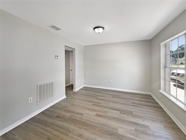4209 SW 33rd St, Ocala, FL 34474 - spare room featuring wood finished floors and baseboards