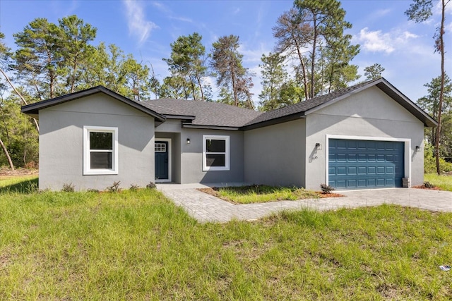 17445 SW 41st Cir, Ocala, FL 34473 - ranch-style house with a garage, stucco siding, and a front lawn