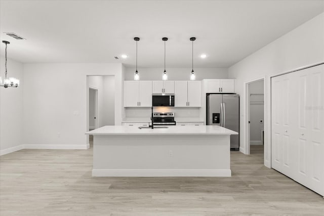 17445 SW 41st Cir, Ocala, FL 34473 - kitchen featuring stainless steel appliances, white cabinets, a chandelier, light countertops, and recessed lighting