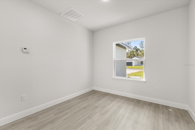 17445 SW 41st Cir, Ocala, FL 34473 - unfurnished room with light wood-type flooring and baseboards