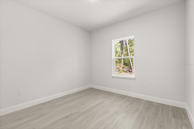 17445 SW 41st Cir, Ocala, FL 34473 - unfurnished room with light wood-style flooring and baseboards