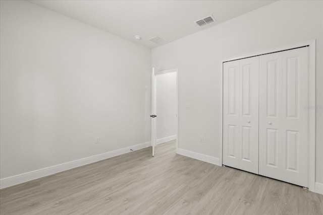 17445 SW 41st Cir, Ocala, FL 34473 - unfurnished bedroom featuring light wood-type flooring and a closet